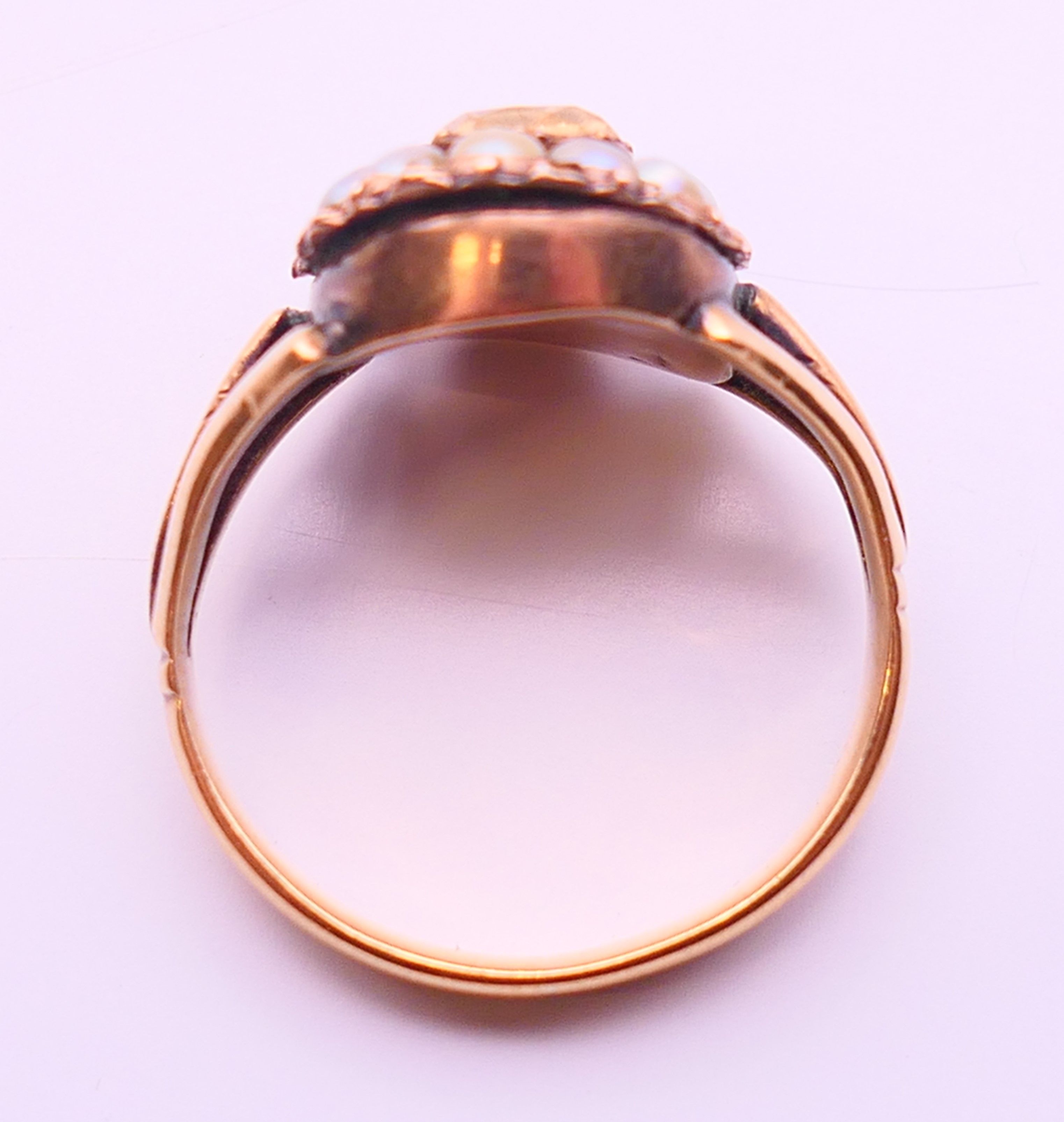 A Georgian unmarked gold Imperial topaz and seed pearl ring. Ring size N. - Image 5 of 5