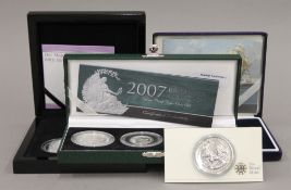 A quantity of various boxed silver proof coins.