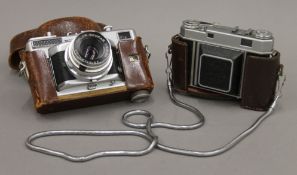 A Kodak Retina IIa camera and a Voigtlander Vitessa T camera.