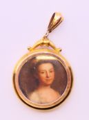 An antique 9 ct gold open locket. 3 cm diameter.