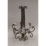 A wrought iron chandelier. 65 cm high.