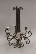 A wrought iron chandelier. 65 cm high.