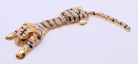 An articulated costume brooch in the form of a tiger. 26 cm long.
