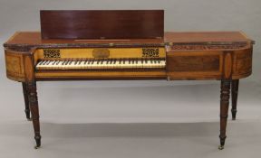 An early 19th century inlaid mahogany square piano. 183 cm long.