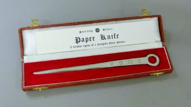 A boxed silver paper knife formed as a Georgian meat skewer. 21 cm long. 55.6 grammes.