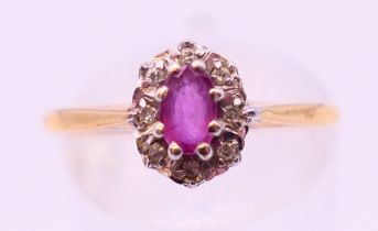 A 9 ct gold diamond and ruby ring. Ring size P.