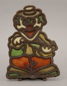 A stained glass clown form candle holder. 16 cm high.