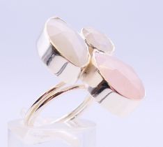 A silver three stone quartz ring. Ring size J/K.