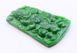 A gold top jade pendant. 6.5 cm high.