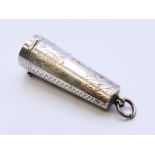 A silver cheroot holder case containing a 9 ct gold edged holder. Case 4 cm high.