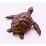 A bronze model of a turtle. 6 cm x 5 cm.