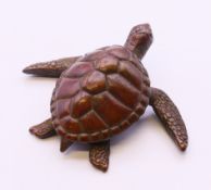 A bronze model of a turtle. 6 cm x 5 cm.