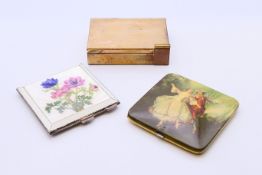 Three decorative ladies' compacts with fitted mirrors. Largest 8.25 cm x 6 cm.