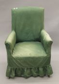An early 20th century upholstered armchair. 66 cm wide.
