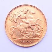 A gold half sovereign, dated 1909.