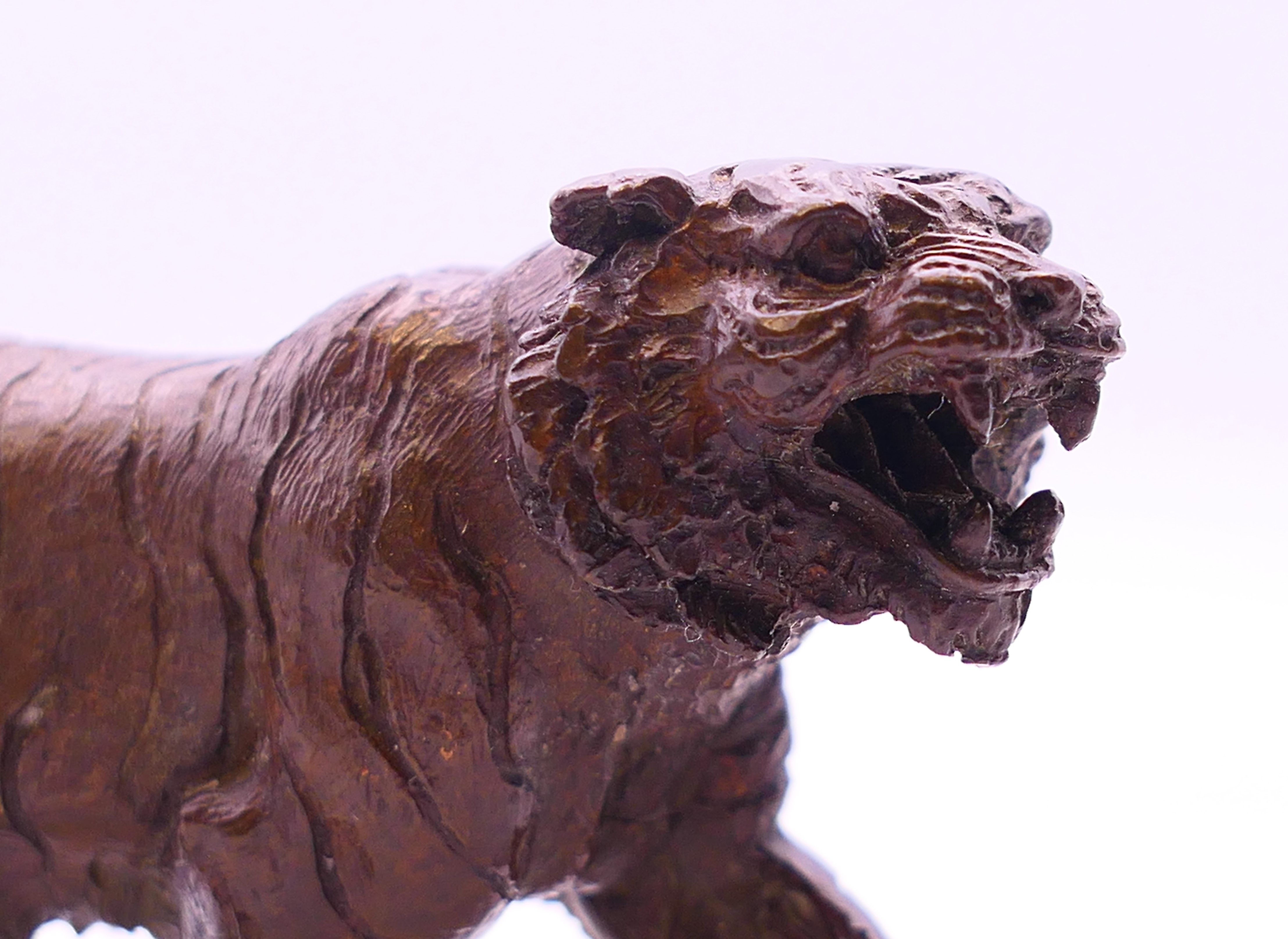 A bronze model of a tiger. 12 cm long, 5 cm high. - Image 3 of 4