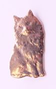 A silver cat brooch. 3 cm high.