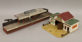 A vintage model railway station and a garage. The former 56 cm long.