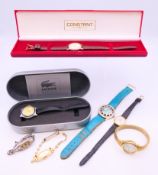 Two ladies cocktail watches, a boxed Lacoste ladies wristwatch and four various wristwatches.