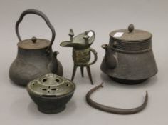 A quantity of Oriental bronze and cast iron wares. The largest 20 cm high.