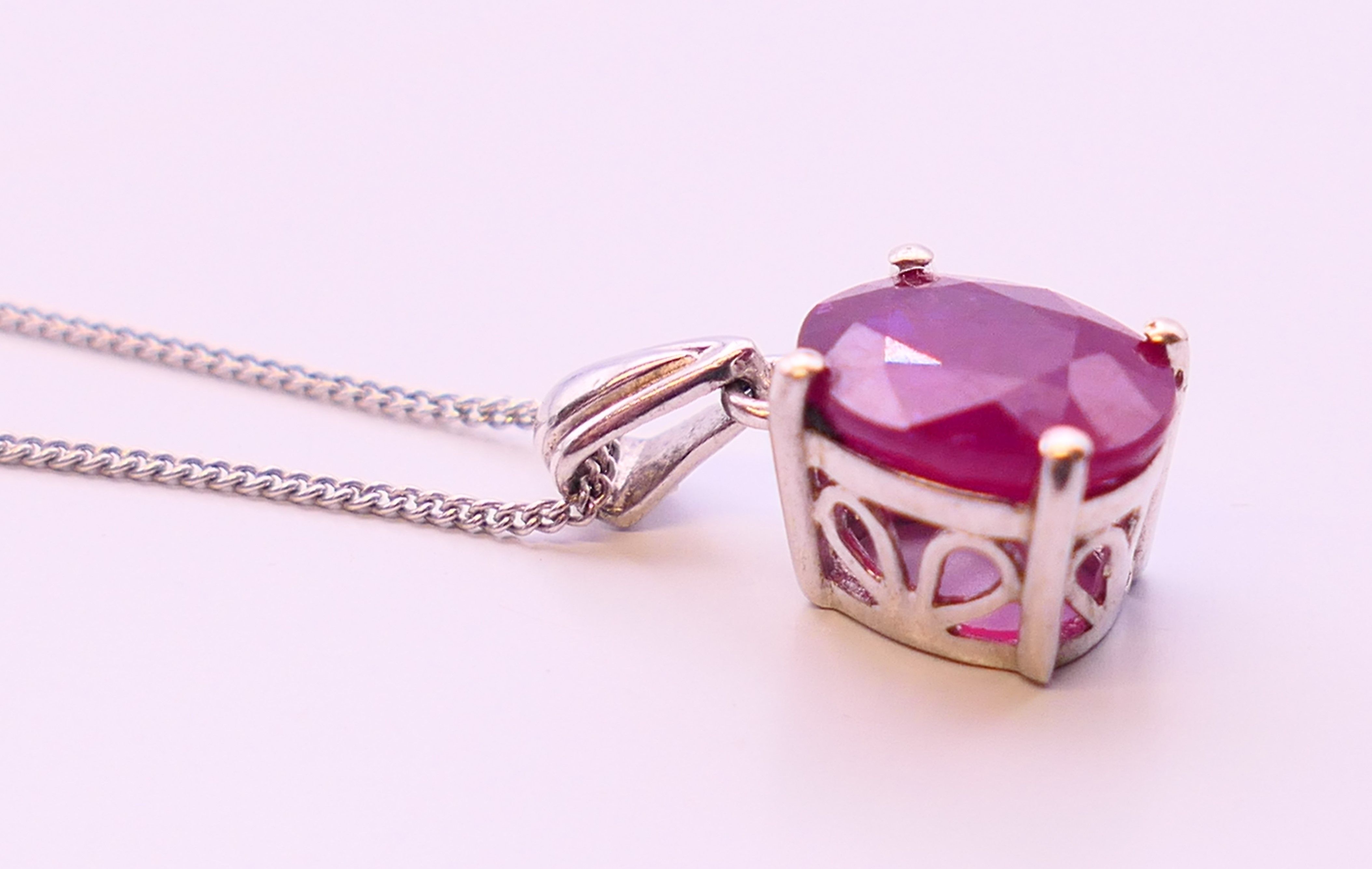 A silver ruby pendant on chain. Pendant 0.75 cm high, chain 45 cm long. - Image 3 of 5