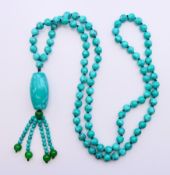 A string of turquoise beads. 80 cm long.