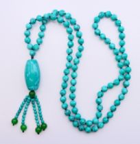 A string of turquoise beads. 80 cm long.