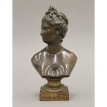 A patinated bronze female bust. 22 cm high.