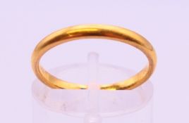 A 22 ct gold wedding band. 2.6 grammes.