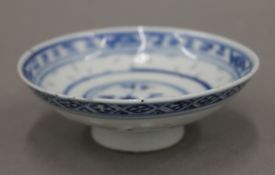 A Chinese blue and white stem bowl, with rice grain decoration and four character mark to the base.