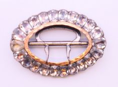 A Georgian paste buckle, cased. 4 cm x 3 cm.
