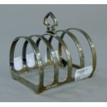 A Mappin and Webb silver toast rack. 8 cm long. 78.4 grammes.