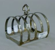 A Mappin and Webb silver toast rack. 8 cm long. 78.4 grammes.