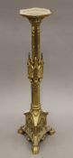 A brass altar stick. 60 cm high.