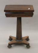 A 19th century rosewood folding games table. 50 cm wide.