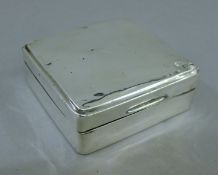 A square silver cigarette box. 8.5 cm wide.