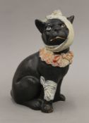 A Victorian pottery model of a dog. 21 cm high.