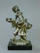 A Continental 800 silver model of a girl on an ebonised plinth base. 18 cm high.
