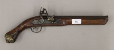 An 18th century and later flintlock pistol. 43cm long.