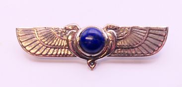 A small silver and lapiz Art Deco style Egyptian style brooch. 5 cm long.