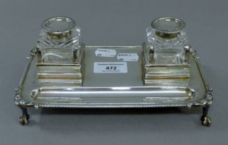 A silver desk stand with cut glass inkwells. 20 cm wide. 12.2 troy ounces.