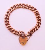 A 9 ct rose gold bracelet with padlock fastener. 20 cm long. 17.
