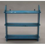 A Victorian blue painted hanging shelf. 56 cm wide.