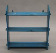 A Victorian blue painted hanging shelf. 56 cm wide.