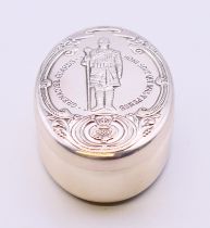 A silver military pill box. 5.5 cm x 3.5 cm.