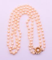 A pearl two-strand necklace with a 9 ct gold clasp. 50 cm long.