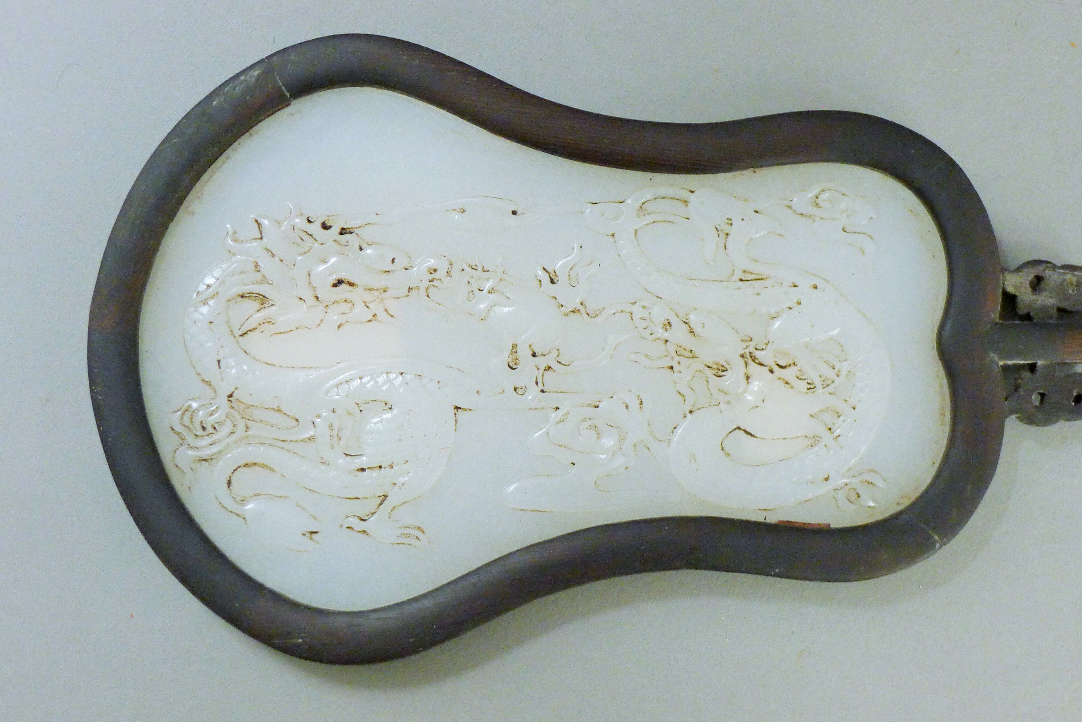 A white jade screen on a carved wooden stand. 31 cm high. - Image 3 of 4