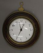 A 19th century brass-mounted hanging wall clock. 16 cm diameter.