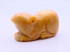A carved hardstone mouse. 8 cm long, 4.5 cm high.