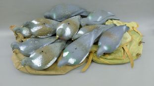 A collection of plastic pigeon decoys. Approximately 34 cm long.